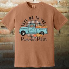 "Take Me to the Pumpkin Patch" T-Shirt - Fall Adventure Awaits! 🚜 Get Ready for Autumn Fun with a Pumpkin-Filled Tee! 🎃 Hit the road to your favorite fall destination with our "Take Me to the Pumpkin Patch" t-shirt! Featuring a charming graphic of a truck brimming with pumpkins, this tee is perfect for celebrating the harvest season and showing off your love for autumn adventures. Why You'll Love It: 🍁 Charming Graphic - The delightful design of a vintage truck loaded with pumpkins captures the essence of a classic pumpkin patch visit, adding a touch of nostalgia and whimsy to your fall wardrobe. 🚜 Comfortable Fabric - Crafted from 100% ring-spun cotton, this shirt offers a soft, breathable fit that's ideal for cool fall days and casual outings. 🍂 Versatile Colors - Available in a ran Brown Letter Print T-shirt For Fall, Brown Graphic Print T-shirt For Fall, Vintage Soft-washed T-shirt For Fall, Cute Fall T-shirt With Screen Print, Thanksgiving Cotton Graphic Print T-shirt, Thanksgiving Cotton T-shirt With Graphic Print, Thanksgiving Graphic Print Cotton T-shirt, Patch Tshirt, Autumn Adventures