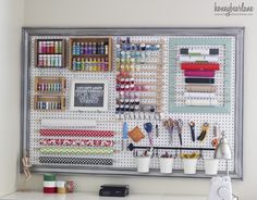 the craft room is organized with pegs, thread and other items to make it look like