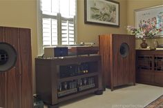 there is a record player and speakers in the room