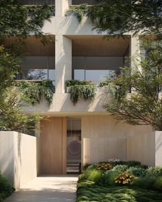 an apartment building with plants growing on the balconies