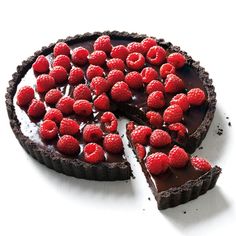 a chocolate tart with raspberries on top