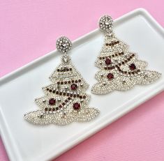 Unwrap the magic of the season with our Beaded White Christmas Tree Earrings - the perfect holiday accessory that effortlessly transitions from Secret Santa surprises to delightful stocking stuffers, making them the ideal Christmas gift or fun addition to any White Elephant exchange. Handcrafted with meticulous care, these earrings feature a charming treedesign adorned with a festive palette of red, green, and gold beads. Whether you're searching for a thoughtful Secret Santa gift, a festive sto Beaded Earrings For Christmas Party, Christmas Party Beaded Earrings, Handmade Beaded Earrings For Holiday Party, Holiday Party Handmade Beaded Earrings, Holiday Party Beaded Earrings, Festive Christmas Beaded Drop Earrings, Festive Beaded Drop Earrings For Christmas, Elegant Beaded Earrings For Holiday, Christmas Party Beaded Drop Earrings