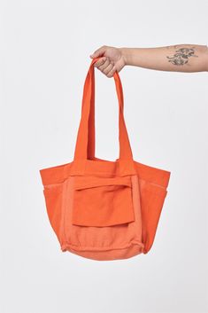 The perfect shoulder-strapped companion for any adventure. This tote is well-proportioned and reversible, with four useful pockets which can be inside or flipped for easy access. Made from a unique blend of recycled scraps and sustainably sourced cotton, developed in partnership with a family factory in Colombia that supports a fair-wage workforce and closed-loop supply chain. Details Unisex Great as a weekender or carry-on bag Reversible, with internal or external pockets 9.5 oz Woven Bull Deni Sustainable Shopping Bag, Everyday Utility Bag With Removable Pouch, Utility Shoulder Bag With Functional Pockets For Everyday, Utility Bags With Functional Pockets For Everyday Use, Utility Bag With Functional Pockets For Everyday Use, Utility Shoulder Bag With Zipper Pocket, Utility Shoulder Bag With Zipper Pocket For Everyday Use, Functional Reversible Everyday Bags, Utility Shoulder Bag With Multiple Pockets For Everyday