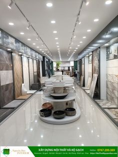 the interior of a shoe store with many shoes on display and lights hanging from the ceiling