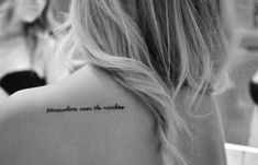 the back of a woman's shoulder with an inscription that reads, somewhere we are sunshine