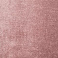 an area rug that is very soft and shiny in pink tones, with some faded edges