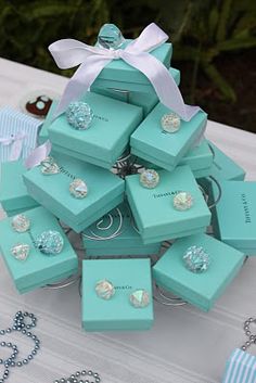 a bunch of jewelry sitting on top of a table next to some necklaces and bracelets