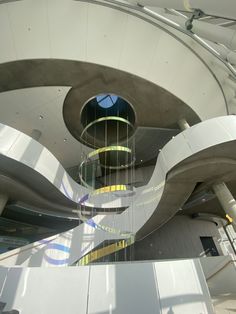 the interior of a modern building with spiral staircases