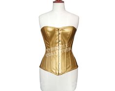 Real Golden Leather With Twill Jeans as Lining Steel Bones Leather Corset Strong Metal Busk Bones Fastening at Front Spiral - Flexible Steel Bones around the corset Rigid Steel Plates at the Back Heavy Duty, Steel Boned Leather Corset Reduce Waist up to 4" It can be used for Tight Lacing, Shaping and waist Training This Fashion Corset is popular uses in Clubbing, As Cosplay, In Wedding on Bride Dress, In Parties and Slim Fitting Pants or Skirts are Beautiful combination with a corset. Available Corset Sizes:- 3XS ~ 7XL (Custom sizing facility available) Available Corset Colors:- Black ~ Brown ~ White ~ Red How to Select Right Size For Example If your natural waist is 30" then you will order "M" size fully Closed 26". Every Corset is 4" Smaller then the Waist. Why Choose Us ? More than 100 Korsett Top, Leather Cosplay, Fashion Corset, Fitting Pants, Steel Plates, Steampunk Corset, Waist Shapers, Lace Tights, Gothic Corset