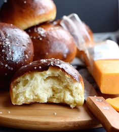 some bread and cheese are on a cutting board