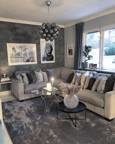 a living room filled with furniture and a chandelier