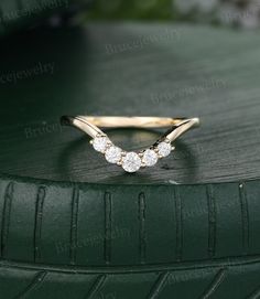 a diamond ring sitting on top of a green tire