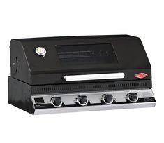 a black grill with four burners on top