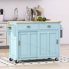 a blue kitchen island cart with wooden top