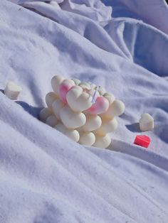 a bunch of candy sitting on top of a blanket