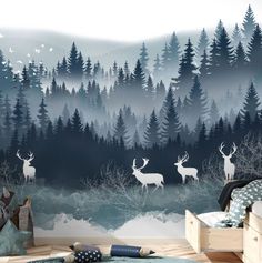 a bedroom with deer and trees painted on the wall