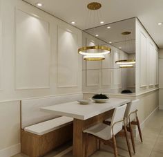 a dining room table with two chairs and a bench in front of the mirror on the wall