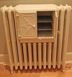 an old fashioned radiator with the door open