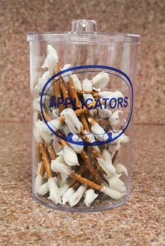 a glass container filled with lots of white and brown food