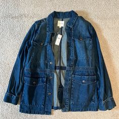 This Medium Denim Jacket Was Originally Purchased On Sale From Anthropologie! It Has Never Been Worn, And Will Make A Great Addition To Your Closet. Adorable Military/Utility Style. Relaxed Fit Denim Utility Jacket, Utility Denim Outerwear With Flap Pockets, Denim Utility Outerwear With Flap Pockets, Fall Medium Wash Utility Jacket, Fall Denim Outerwear With Flap Pockets, Spring Denim Utility Outerwear, Utility Denim Top With Pockets, Dark Wash Utility Jacket With Flap Pockets, Washed Medium Wash Utility Jacket