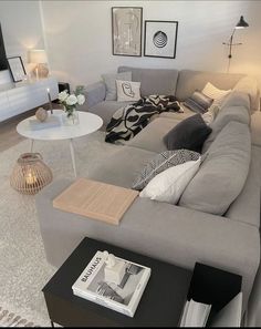 a living room filled with lots of furniture and decor