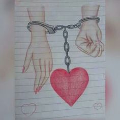 two hands are chained to a red heart on a piece of paper with the word love written