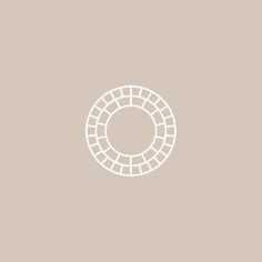 a white circle on a beige background