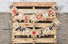 a welcome home sign made out of wooden pallets