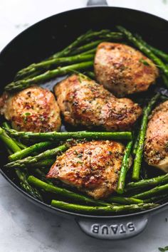 chicken and asparagus in a skillet