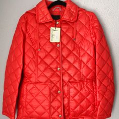 Short Quilted Coat Features A Hood And Patch Pockets For Functional Warmth And Style. Spread Collar With Attached Hood And Drawstrings. Long Sleeves. Button Front Closure. Patch Pockets. Quilted Construction Trendy Red Outerwear With Button Closure, Red Button-up Outerwear With Snap Buttons, Red Winter Outerwear With Snap Buttons, New Jacket, Quilted Coat, Sam Edelman, Patch Pocket, Jackets For Women, Jackets & Coats