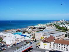 an aerial view of the beach and ocean