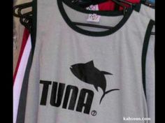 there is a t - shirt with tuna on it hanging from a clothes hanger