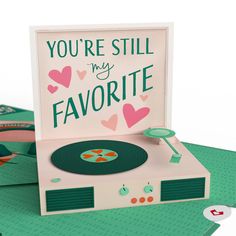 there is a card that says you're still my favorite on the record player