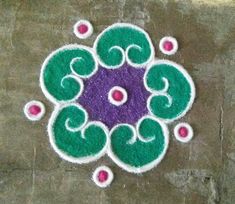 a colorful rangdi design on the ground for diwaling