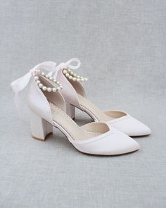 "Classic and elegant lace almond toe block heels with pearl ankle straps. Perfect for weddings, parties, or any special occasion. DETAILS: HEEL HEIGHT: 3 inches COLORS AVAILABLE: Ivory, White, Light Blue, Dusty Pink, Champagne, Burgundy, Navy and Black UPPER: Synthetic upper and lining MATERIALS: Mandmade outsole STYLE NAME: SALLY Not sure of which size to purchase? Shoes measurements are as follow: (Please note measurements taken the length of inside of shoe from toe to heel). Size 5 - 9.25\" S Block Heel Wedding Shoes, Shoes Editorial, Flower Girl Shoes, Bridal Flats, Ankle Strap Block Heel, Satin Shoes, Wedding Shoes Heels, Pink Ivory, Bridesmaid Shoes