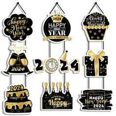 a happy new year hanging decoration with gold and black decorations