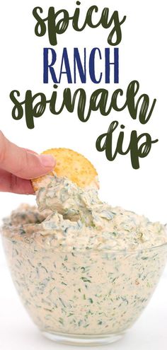 a hand dipping ranch dip into a bowl with the words spicy ranch dip above it