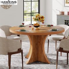 a round wooden table with white chairs around it and flowers in vase on the table