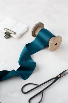 Teal satin ribbon  Double-faced 100% polyester Made in India Wood spool is sold separately. If your desired width/length is out of stock, please inquire.  Choose from four widths: * 1½" wide * 2¼" wide (pictured) * 3" wide * 4" wide Full spool yardage: (if out of stock, contact for availability) * 1½" wide - 50 yards * 2¼" wide - 100 yards * 3" wide - 100 yards * 4" wide - 100 yards Hand-wound into a roll. If ordering multiple quantities, the ribbon may arrive as consecutive yardage. Bulk quanti Satin Sashes With Ribbon For Gift, Teal Ribbon, Wood Spool, Battle Ground, Dusty Purple, Desktop Accessories, Purple Velvet, Velvet Ribbon, Double Face