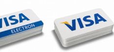 two visa cards sitting side by side on top of each other in front of a white background