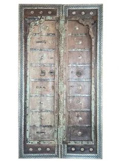 an old wooden door with ornate carvings on it