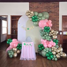 balloons and streamers decorate the entrance to a st patrick's day themed party