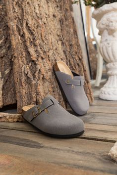 Exude casual-cool style in comfort in these slip-on-and-go clogs, crafted from a soft suede in a versatile neutral hue for effortless pairing. A durable TPU sole ensures tread-safe steps. Suede upper Man-made leather lining Man-made insole TPU sole Casual Slip-on Slippers With Buckle Closure, Casual Closed Toe Clogs With Cork-bed Midsoles, Casual Clogs With Cork-bed Midsoles, Casual Closed Toe Clogs With Textured Footbed, Casual Suede Mules With Cork-bed Midsoles, Casual Slip-on Mules With Buckle Closure, Casual Slip-on Clogs With Cork-bed Midsoles, Slip-on Clogs With Textured Footbed And Flat Heel, Casual Mules With Buckle Closure For Outdoor