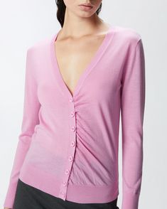 Slim-fitting cardigan in soft 100% wool knit fabric with long sleeves, wide V-neck and buttoned front. Perfect to wear with your favourite jeans, this cardigan will give your looks a classic, timeless and ever-original touch for those early season days. Fitted Fine Knit V-neck Outerwear, Fitted Merino Wool V-neck Top, Pink V-neck Cardigan For Work, Fitted Fine Knit V-neck Sweater, Fitted Fine Knit V-neck Sweater For Spring, Pink Cashmere Cardigan For Fall, Chic Merino Wool V-neck Cardigan, Chic V-neck Merino Wool Cardigan, Casual Pink Cashmere Cardigan