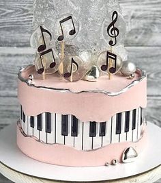 a pink cake with musical notes on it