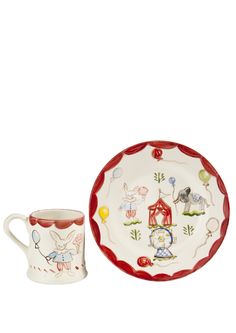 a cup and saucer with farm animals on it