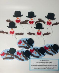 snowmen with hats and scarfs are on display