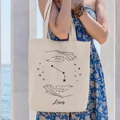 "Sport your zodiac sign on this cute tote bag! Also a great gift option! .: Measurements: 15.75\" tall, 12.25\" wide .: Handle length is 21.5\" with reinforced stitching .: Material: 100% cotton sheeting .: Lightweight and compact *Please keep in mind that each tote bag is made to order, so production and shipping times may vary* Click on my shop name to check out my other listings! 😍 **Also, please feel free to let me know if you'd like this print on a shirt or sweatshirt and I'd be happy to m Aries Constellation, Diy Tote, Market Ideas, Bag Designs, Funny Christmas Sweaters, Print Studio, Cute Tote Bags