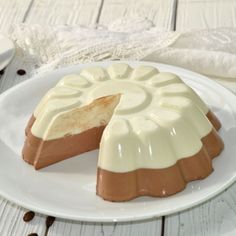 a white plate topped with a piece of cake