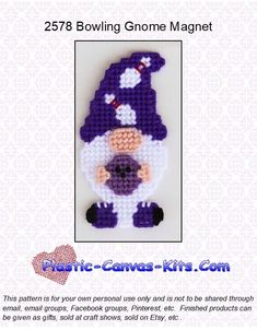 a purple and white cross stitched gnome